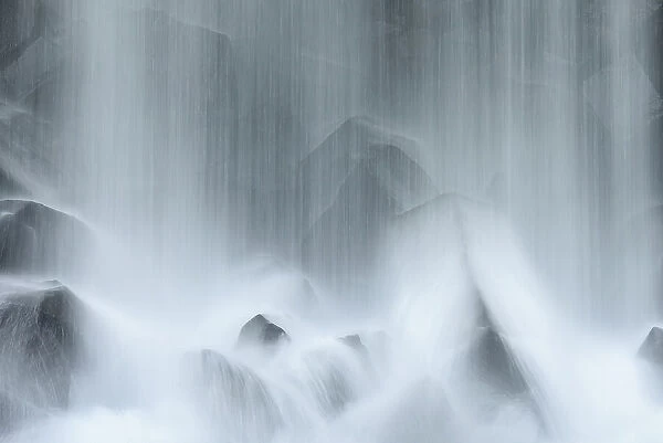Svartifos waterfalls hiding wall of basalt columns, Vatnajokull National Park, Iceland. July
