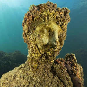 Ancient Roman statue of Antonia minor, member of Julio-Claudian dynasty, daughter of Marcus Anthony and sister of emperor Augustus, located in submerged Nymphaeum of Emperor Claudius. Marine Protected Area of Baia, Naples, Italy. Tyrrhenian sea