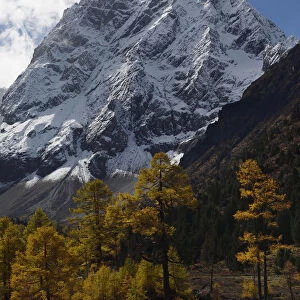 Autumn landscape in the U-shaped valley. Snow covered mountain landscape and vegetation