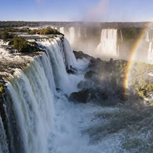 Rainbow over Iguasu Falls, on the Iguasu River, Brazil / Argentina border