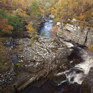 River Tromie flowing through a small gorge in autumn. Cairngorms, Scotland, October 2009