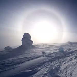 Sundog / Parhelion (circle of light around the sun) with large ice fumerole in the foreground