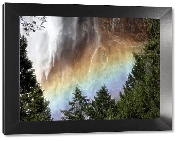 Sunlight creating a rainbow in the spray of the Bridalveil Falls, Yosemite National Park