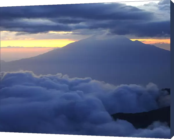 Dusk and clouds on Mount Kilimanjaro with Mount Meru in background (4566m), both volcanos