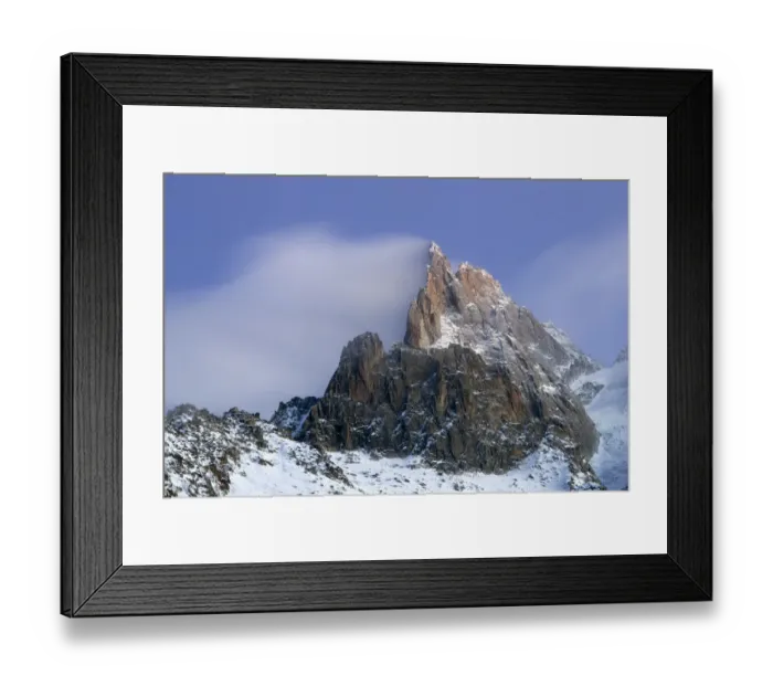 Framed Print : Mountains in snow, Aiguille du Dru with snow blowing off from the top at night. Chamonix Framed Print : Mountains in snow, Aiguille du Dru with snow blowing off from the top at night. Chamonix