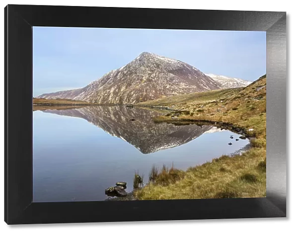 Pen yr Ole Wen reflected in Llyn Idwal in the Glyderau mountains in Snowdonia, North Wales