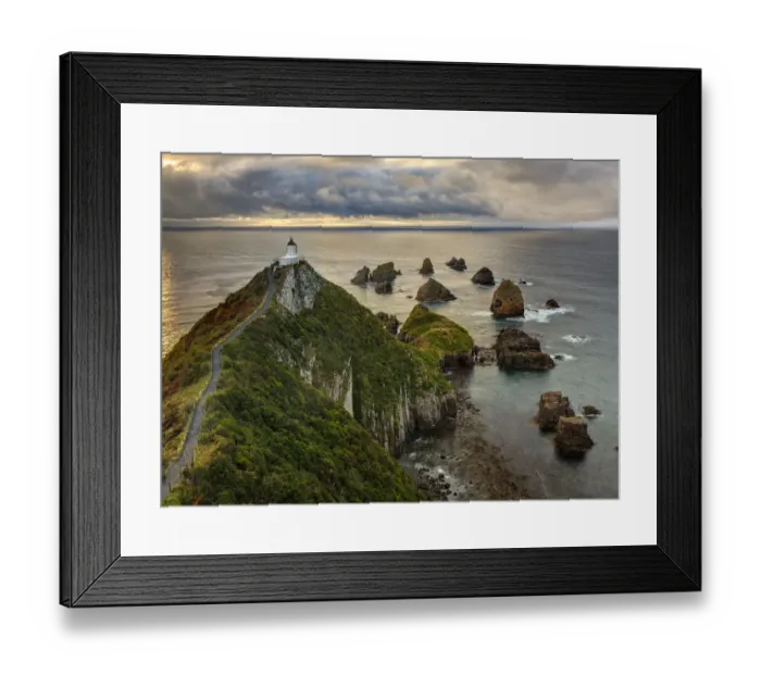 Framed Print : RF- Nugget Point (Ka Tokata) lighthouse at sunrise, rain clouds sweeping in from the horizon Framed Print : RF- Nugget Point (Ka Tokata) lighthouse at sunrise, rain clouds sweeping in from the horizon