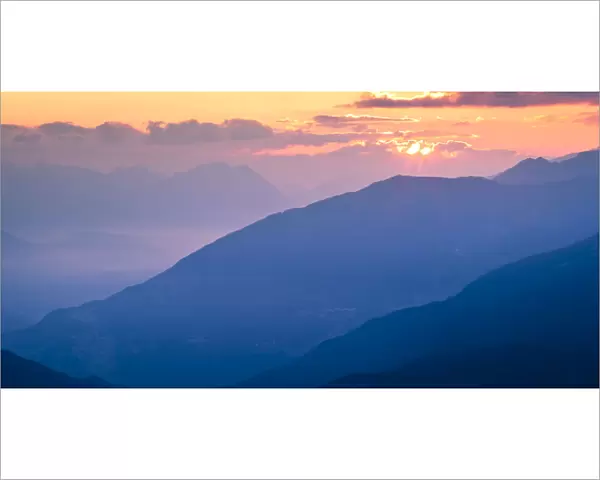 Sun rising over mountain landscape at dawn. Nordtirol, Tirol, Austrian Alps, Austria