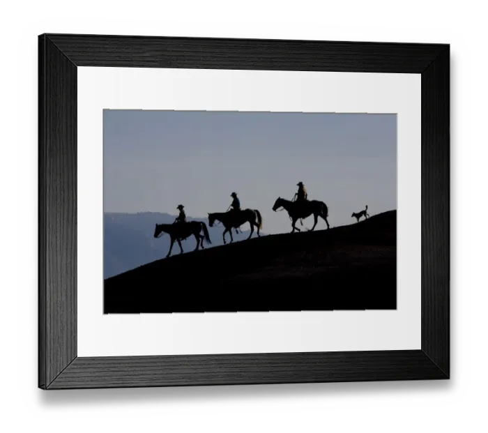 Framed Print : Silhouette of three cowboys and a dog riding down a ridge, Flitner Ranch, Shell, Wyoming Framed Print : Silhouette of three cowboys and a dog riding down a ridge, Flitner Ranch, Shell, Wyoming