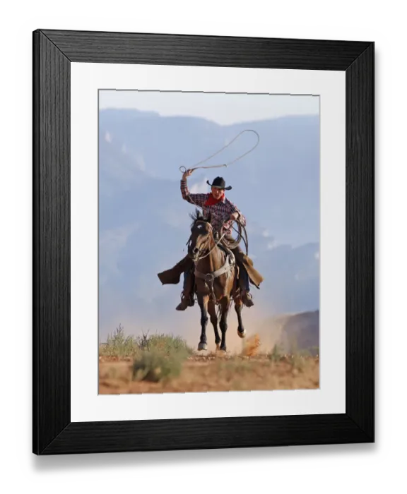 Framed Print : Cowboy running with rope lassoo in hand, Flitner Ranch, Shell, Wyoming, USA, model Framed Print : Cowboy running with rope lassoo in hand, Flitner Ranch, Shell, Wyoming, USA, model