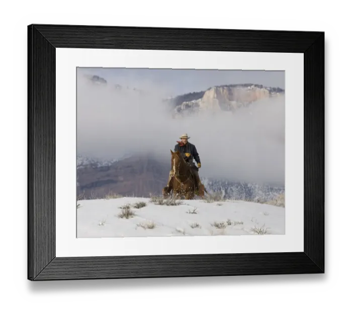 Framed Print : Cowboy riding over hill in snow, Sombrero Ranch, Craig, Colorado, USA Model released Framed Print : Cowboy riding over hill in snow, Sombrero Ranch, Craig, Colorado, USA Model released