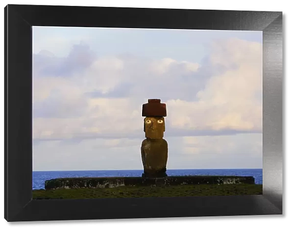 Silhouette of Moai statue at dawn in Ahu Ko Te Riku, restored archaeological site of Ahu Tahai