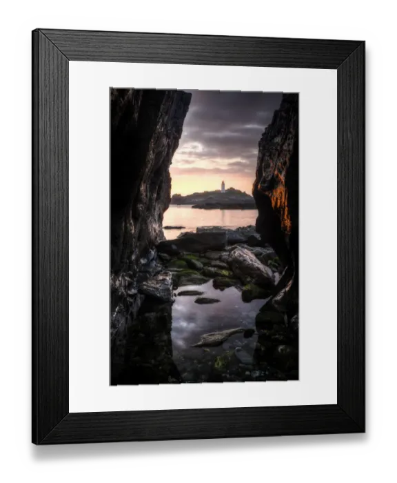 Framed Print : Godrevy Lighthouse at sunset, seen through rocksand rockpool in the foreground. Nr Hayle Framed Print : Godrevy Lighthouse at sunset, seen through rocksand rockpool in the foreground. Nr Hayle