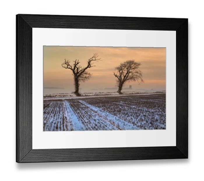 Framed Print : Snow on stubble field at dusk with Southrepps Church in the background, North Norfolk Framed Print : Snow on stubble field at dusk with Southrepps Church in the background, North Norfolk