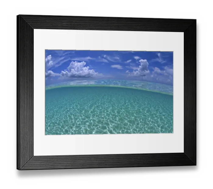 Framed Print : A split level view of shallow water and clouds in summer, Seven Mile Beach, Grand Cayman Framed Print : A split level view of shallow water and clouds in summer, Seven Mile Beach, Grand Cayman
