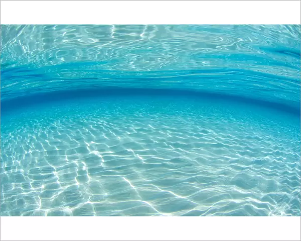 Underwater scene where light and water interplay on a shallow sand bank, Grand Cayman