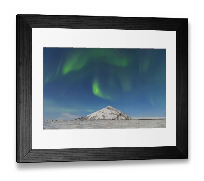 Framed Print : Northern lights  /  Aurora borealis over snowy landscape, Iceland, Europe, March 2012