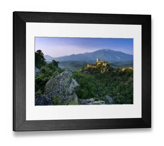 Framed Print : The village of Eus perched on a hilltop with sunlight with the Pic de Canigou beyond Framed Print : The village of Eus perched on a hilltop with sunlight with the Pic de Canigou beyond