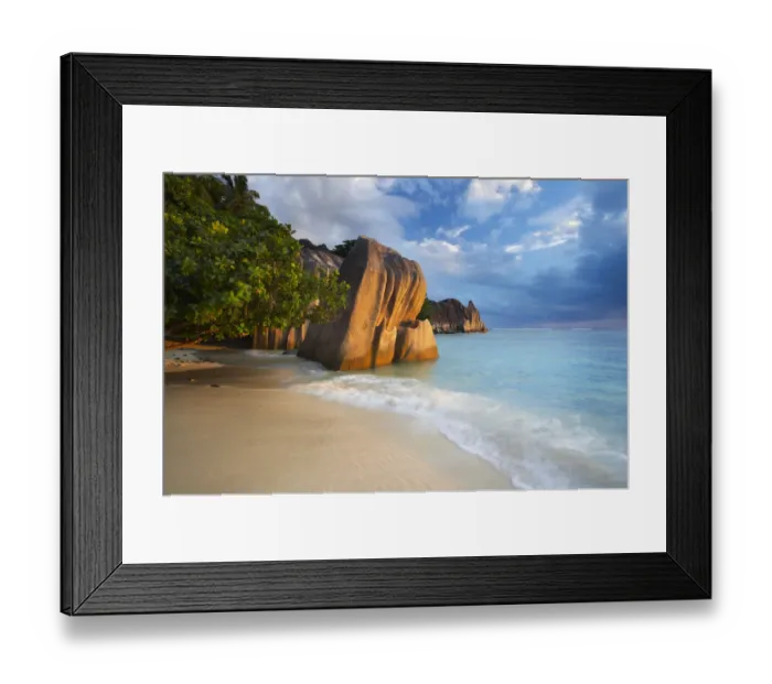 Framed Print : Dramatic evening sky over Anse Source d Argent, La Digue. Seychelles. February 2007 Framed Print : Dramatic evening sky over Anse Source d Argent, La Digue. Seychelles. February 2007