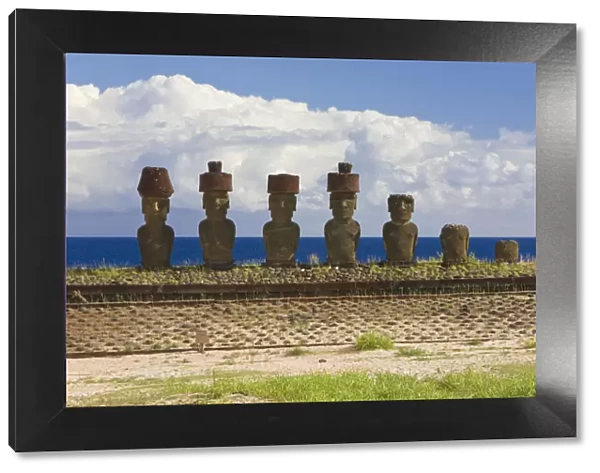 Anakena beach, monolithic giant stone Moai statues of Ahu Nau Nau, four of which have topknots