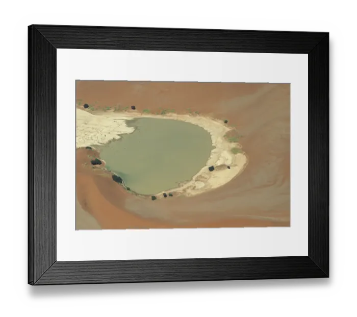 Framed Print : View of lake surrounded by sand dunes, with some vegetation growing around the edges Framed Print : View of lake surrounded by sand dunes, with some vegetation growing around the edges