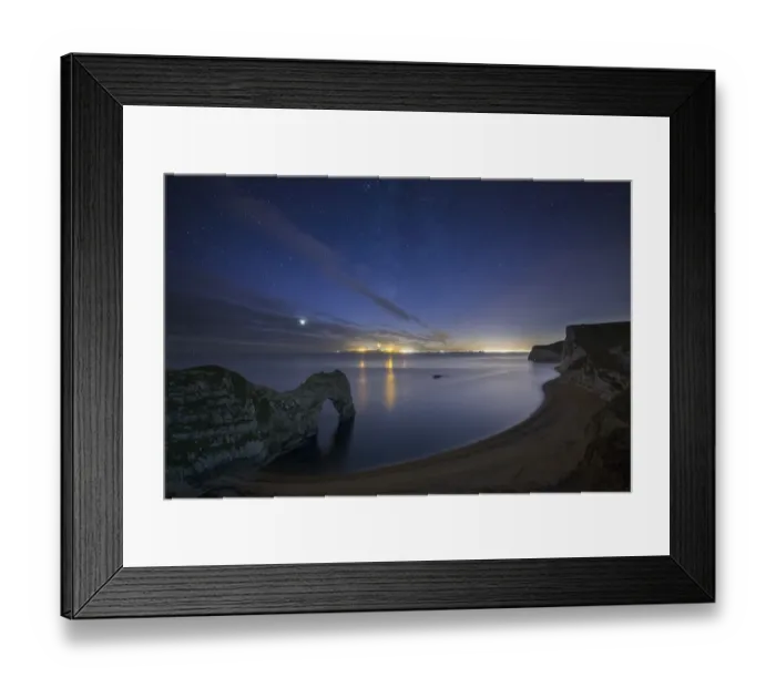 Framed Print : Stars and Milky Way over Durdle Door and the Jurassic Coast, with the lights of Weymouth Framed Print : Stars and Milky Way over Durdle Door and the Jurassic Coast, with the lights of Weymouth