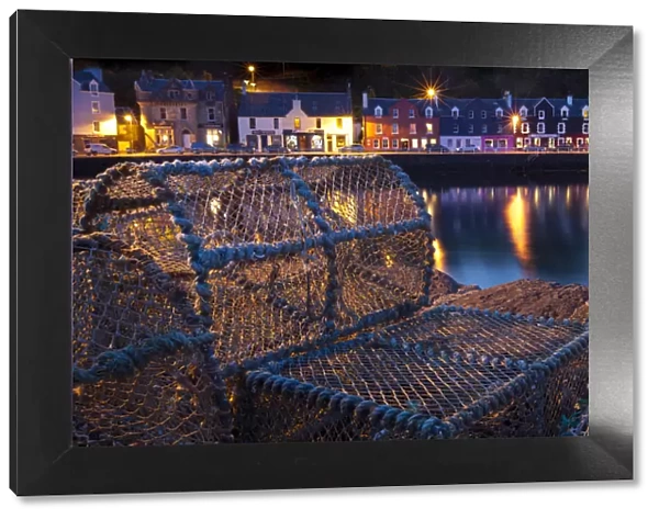 Lobster pots on harbourside at night, Tobermory harbour, Isle of Mull, Scotland