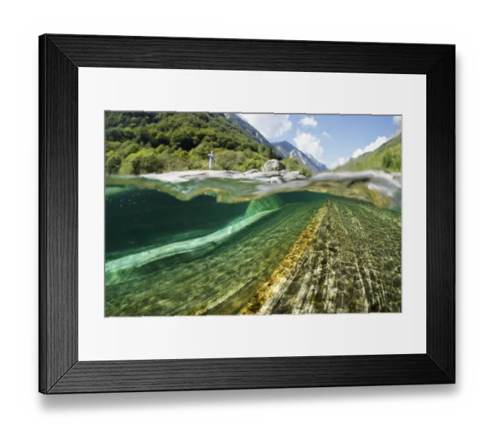 Framed Print : Split level view of blue green waters of Verzasca River flowing over granite rocks at Lavertezzo Framed Print : Split level view of blue green waters of Verzasca River flowing over granite rocks at Lavertezzo