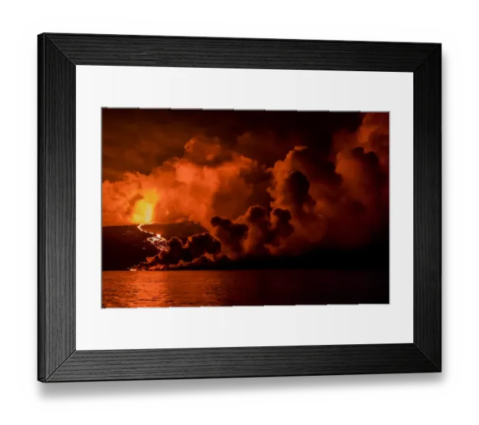 Framed Print : Plume of smoke from Wolf Volcano erupting, with reflections in water, Isabela Island