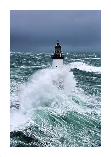 Rough seas at d'Ar-Men lighthouse during Storm Ruth, Ile de Sein, Armorique Regional Park. Iles du Ponant, Finistere, Brittany, France, Iroise Sea. 8th February 2014