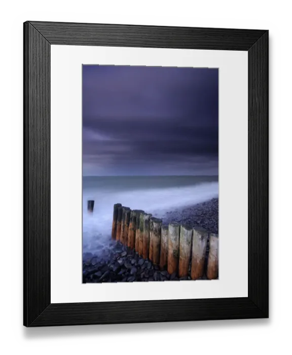 Framed Print : Weathered groyne, pebbles and stormy evening sky at Bossington beach, Exmoor National Park Framed Print : Weathered groyne, pebbles and stormy evening sky at Bossington beach, Exmoor National Park