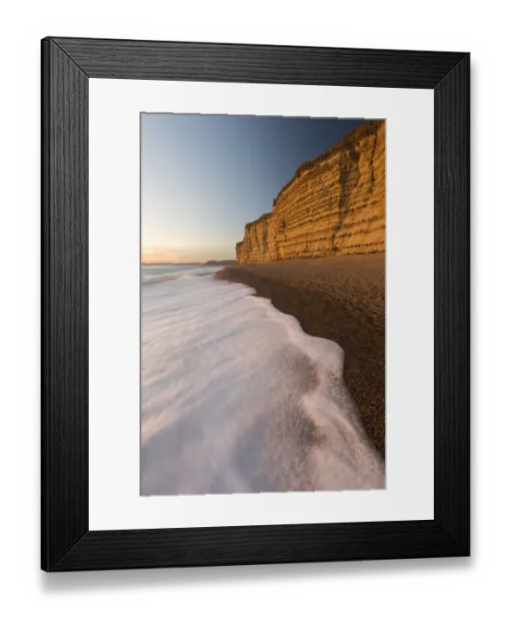Framed Print : Foam on beach below cliffs at Burton Bradstock, late evening light, Dorset, UK. November 2016 Framed Print : Foam on beach below cliffs at Burton Bradstock, late evening light, Dorset, UK. November 2016