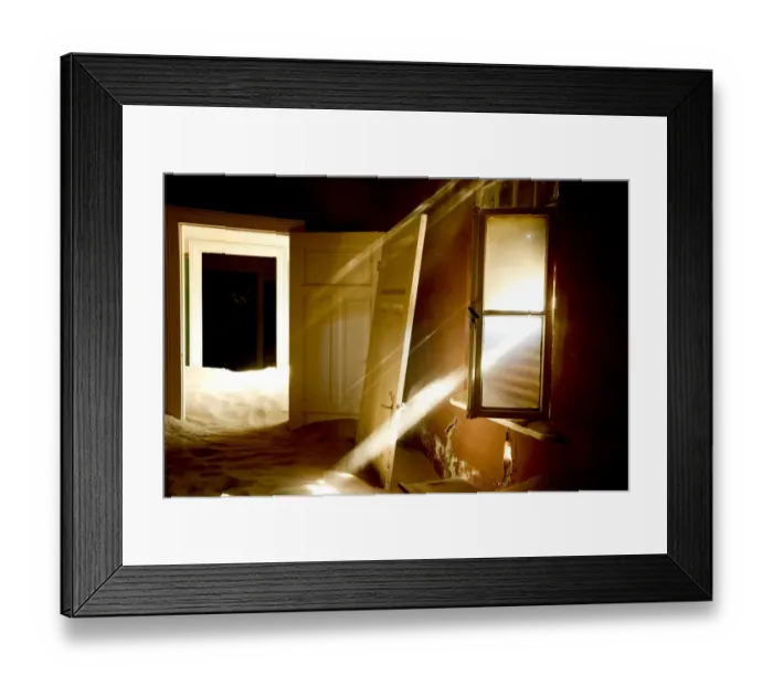 Framed Print : Light streaming through window on sand covered house in Kolmanskop Ghost Town, an Framed Print : Light streaming through window on sand covered house in Kolmanskop Ghost Town, an