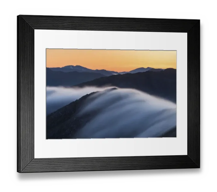 Framed Print : Long exposure of mist flowing over Bhudhie Bheinn at dawn with the mountains of Kintail Framed Print : Long exposure of mist flowing over Bhudhie Bheinn at dawn with the mountains of Kintail