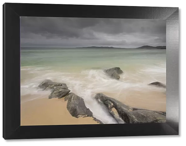 Rocks on Seilebost beach with storm approaching, North Harris, Outer Hebrides, Scotland