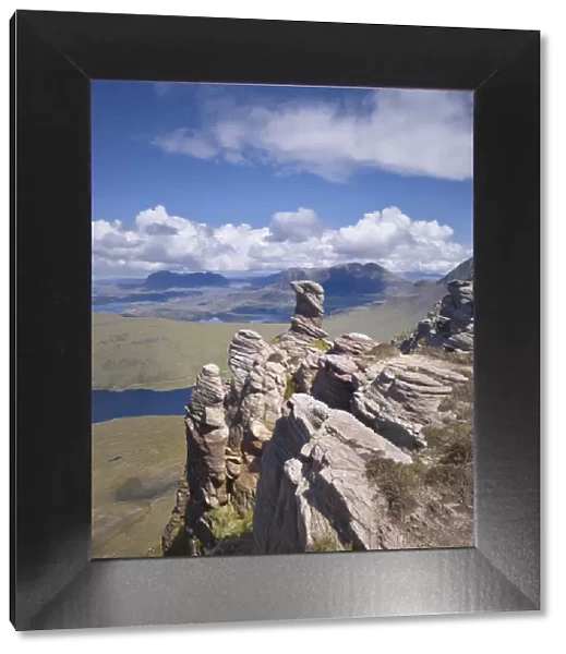 View from summit of Sgorr Tuath, sandstone pinnacles, Assynt mountains, Highland