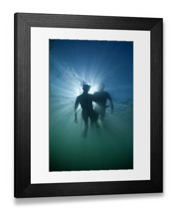 Framed Print : Snorkellers viewed from below, Kimmerage Bay, Dorset, UK, August Framed Print : Snorkellers viewed from below, Kimmerage Bay, Dorset, UK, August