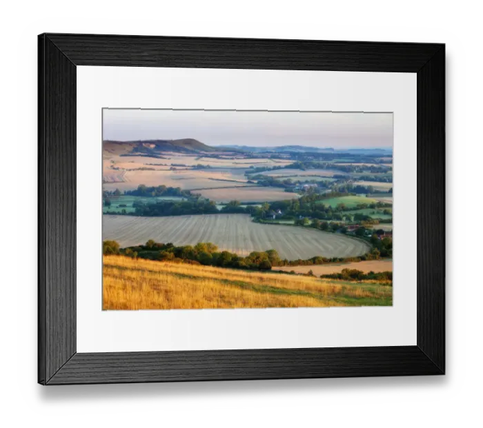 Framed Print : Rolling chalk downland and arable farmland viewed from Wilmington Hill, Wilmington Framed Print : Rolling chalk downland and arable farmland viewed from Wilmington Hill, Wilmington