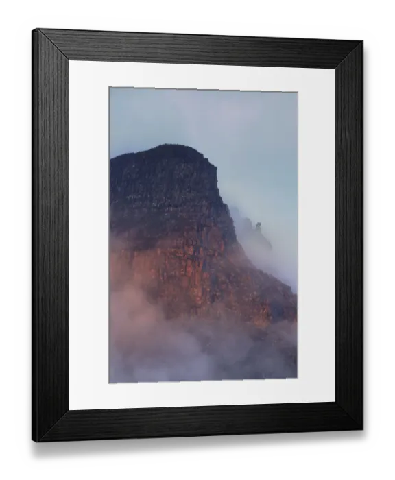 Framed Print : The rugged cliffs of Stac Pollidh in cloud and mist and lit by evening light Framed Print : The rugged cliffs of Stac Pollidh in cloud and mist and lit by evening light