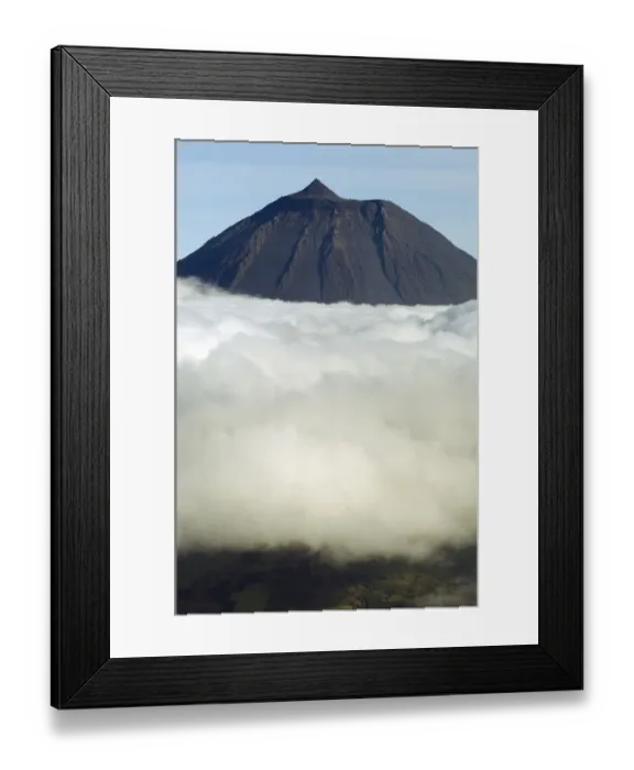 Framed Print : Clouds around Pico, the highest mountain in Portugal, sticking out through a loayer of clouds Framed Print : Clouds around Pico, the highest mountain in Portugal, sticking out through a loayer of clouds