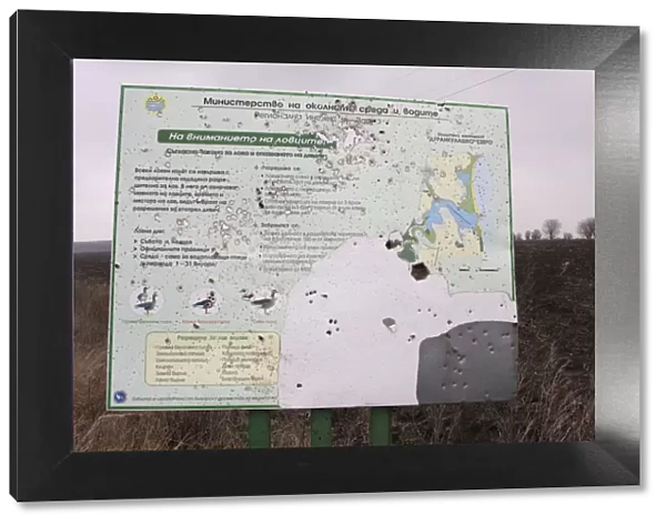 Battered sign showing the information about the area around Durankulak Lake, Bulgaria
