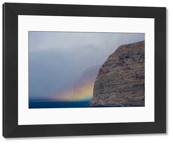 Acantilado de los Gigantes (Giants cliffs) with a rainbow over the sea, West Tenerife