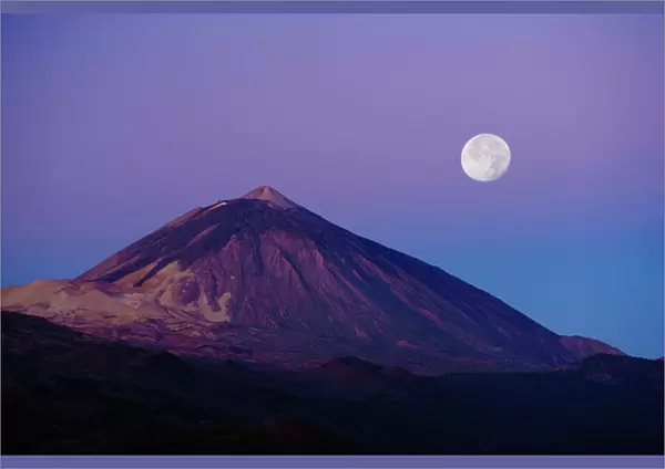 Full moon over Teide volcano (3, 718m) at sunrise, Teide National Park, Tenerife, Canary Islands