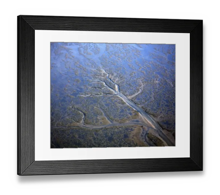 Framed Print : Aerial view of coastal landscape at low tide with channels and pools, Hallig, Germany Framed Print : Aerial view of coastal landscape at low tide with channels and pools, Hallig, Germany