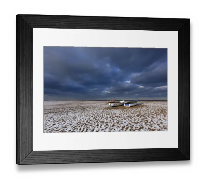 Framed Print : Cley Beach with scattering of light snow, and boats, Norfolk, England, UK, December 2010 Framed Print : Cley Beach with scattering of light snow, and boats, Norfolk, England, UK, December 2010