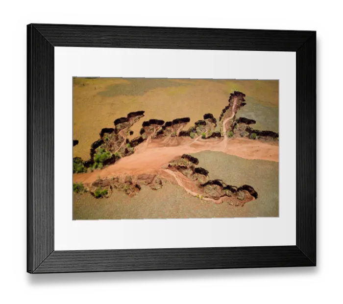 Framed Print : Aerial view of eroded banks and river with suspended load, caused by deforestation Framed Print : Aerial view of eroded banks and river with suspended load, caused by deforestation