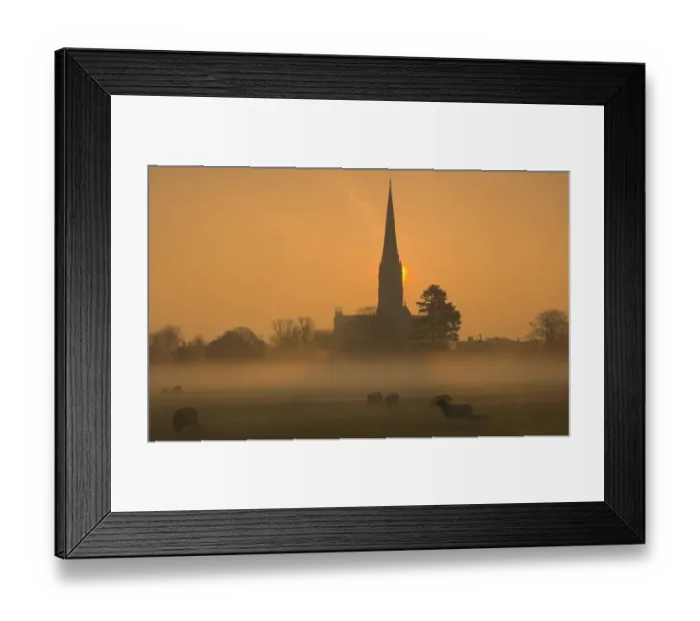 Framed Print : Sun rising through mist behind Salisbury Cathedral viewed across Harnham Water Meadows Framed Print : Sun rising through mist behind Salisbury Cathedral viewed across Harnham Water Meadows