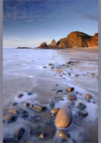 Tide washing over pebbles at Sandymouth bay, north Cornwall, UK. January 2009