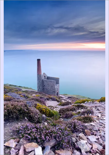 View of Towanroath Engine House and out over the sea in the late evening light. Wheal Coates