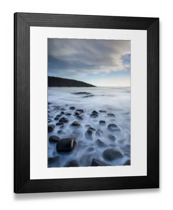 Framed Print : Waves washing over the rocks, Cullernose Point at dawn, Northumberland, UK. March 2014